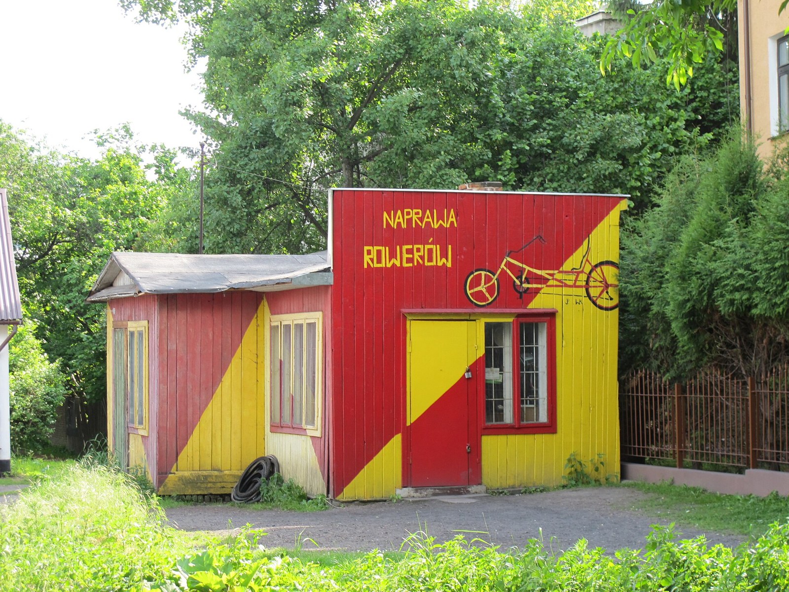Bicycle repair shop with Polish naprawa rowerow lettering in Zamosc, illustrative photograph