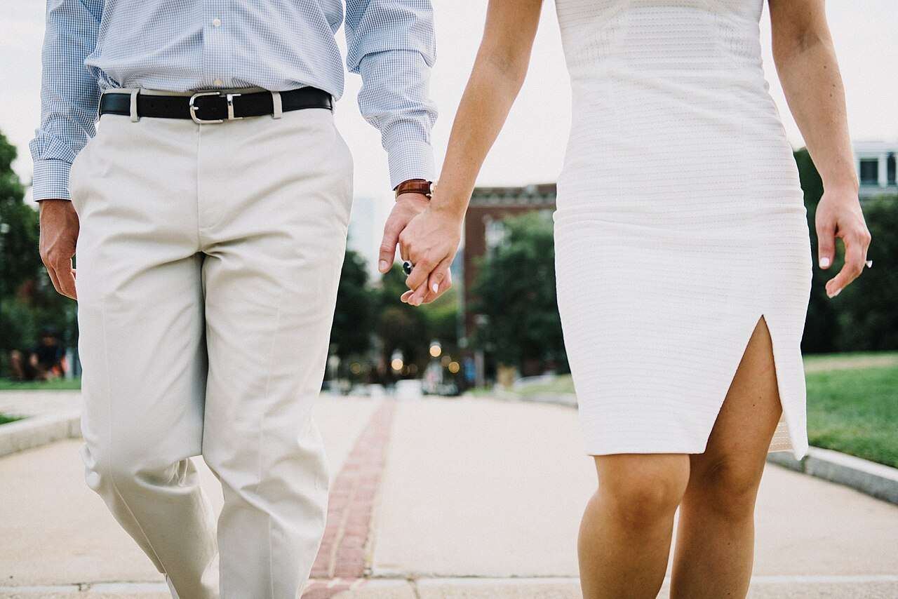 Elderly couple holding hands