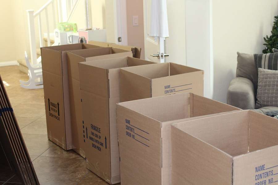 Cardboard moving boxes stacked in an apartment, ready for a move-out
