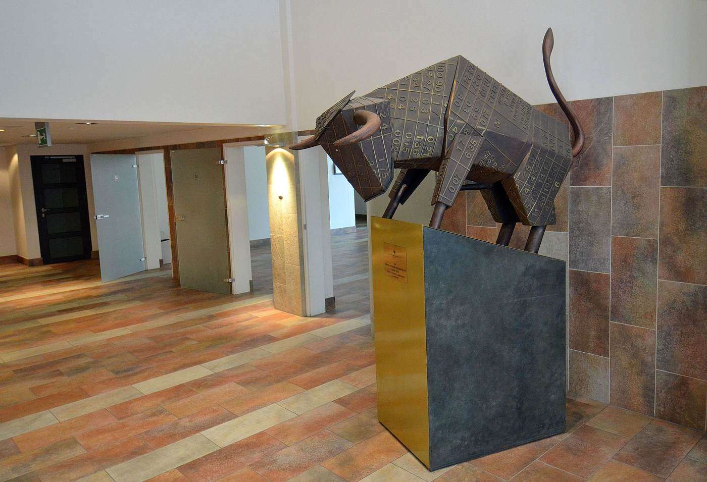 The bull statue at the Warsaw Stock Exchange - capital gains in Poland are taxed at a flat 19% on PIT-38