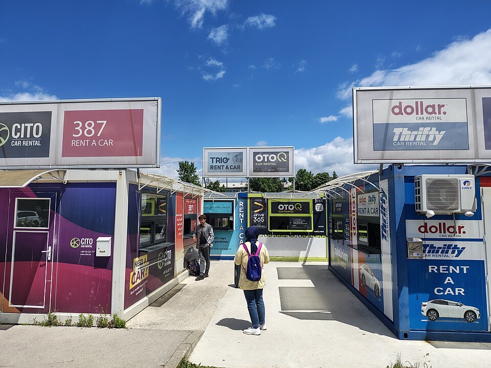 Car-rental kiosks at Sarajevo Airport photographed in May 2025