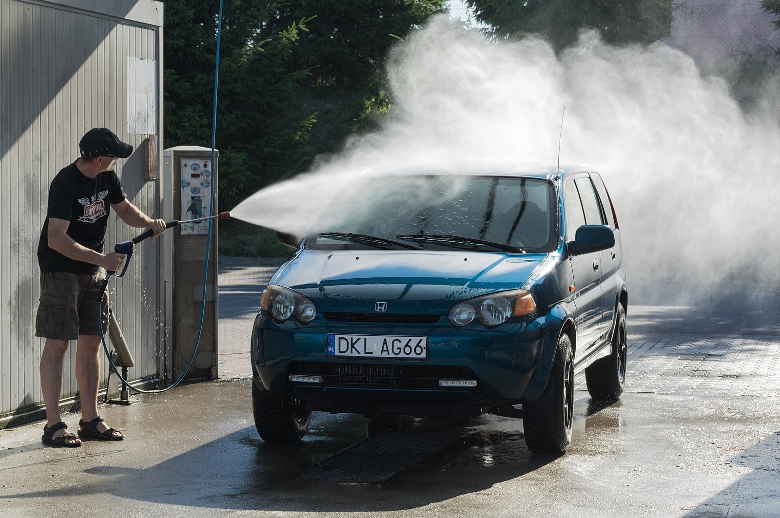 A car being pressure washed at a self-service bay in Klodzko in 2015