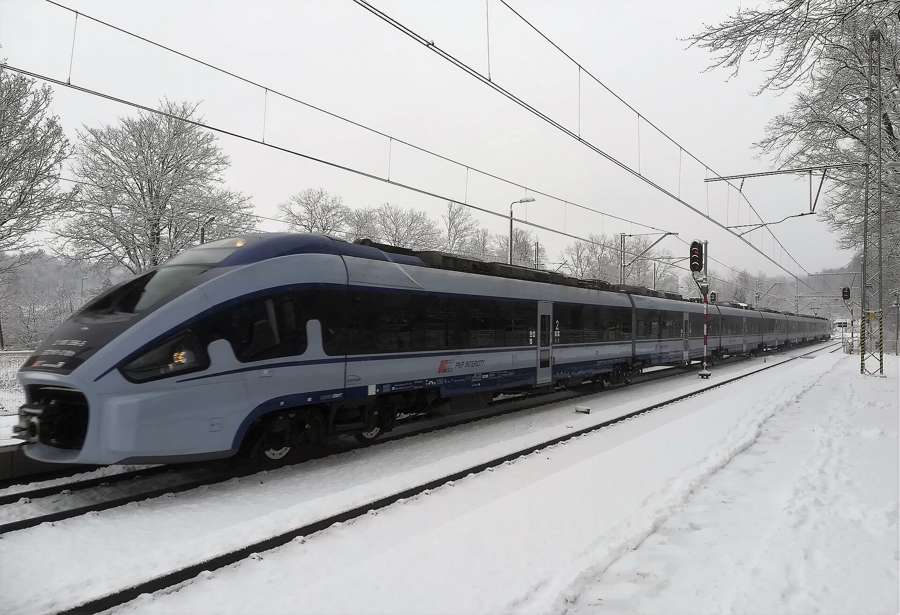 A PKP Intercity Pendolino train in the snow at Janowice Wielkie