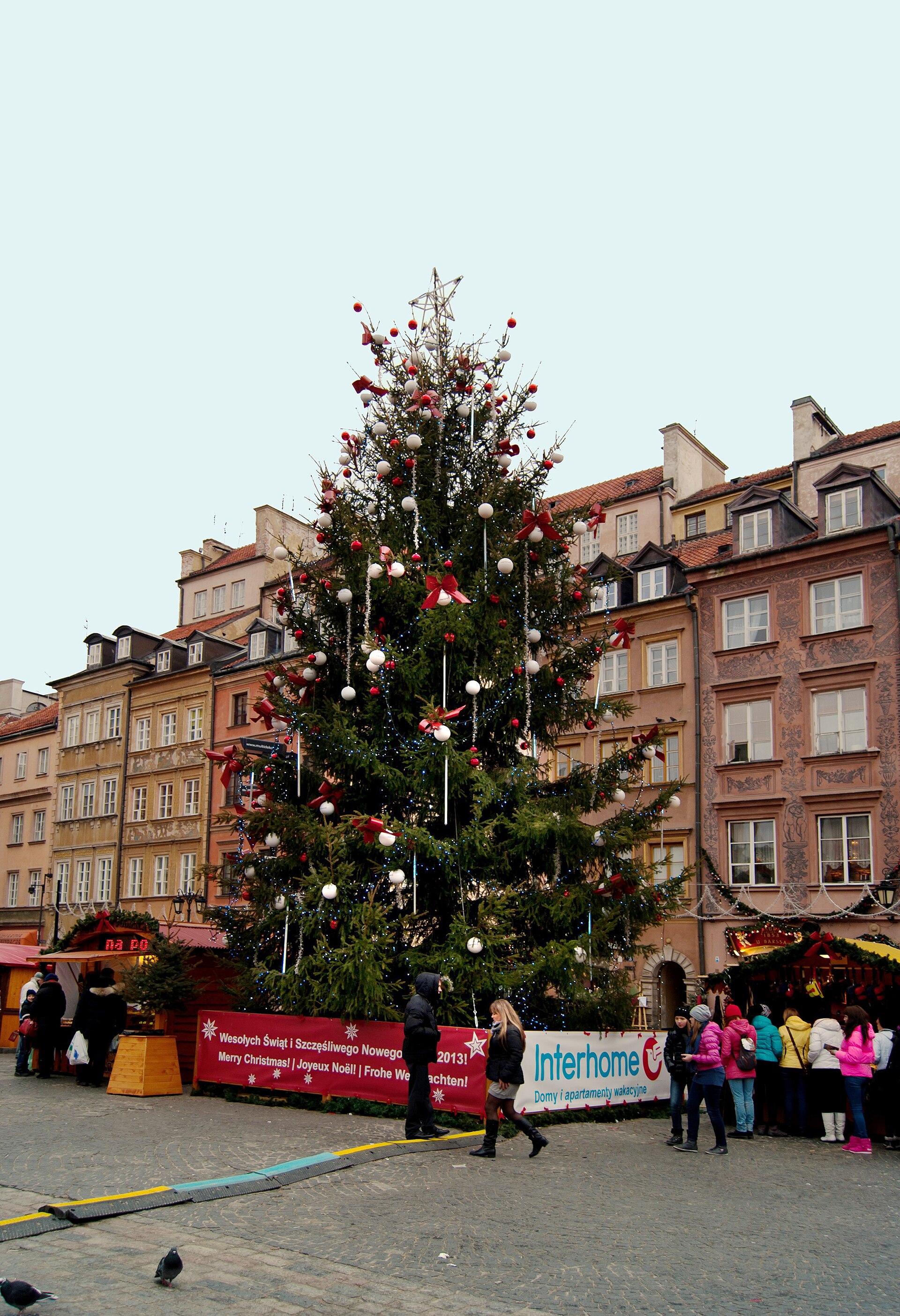 The city Christmas tree on Warsaw's Old Town Market Square in December 2013, surrounded by market stalls