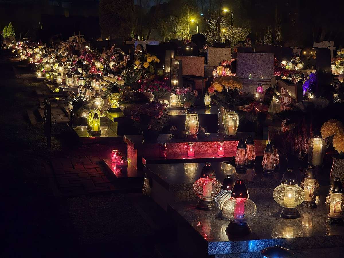 Graves decorated with candles in a Polish cemetery