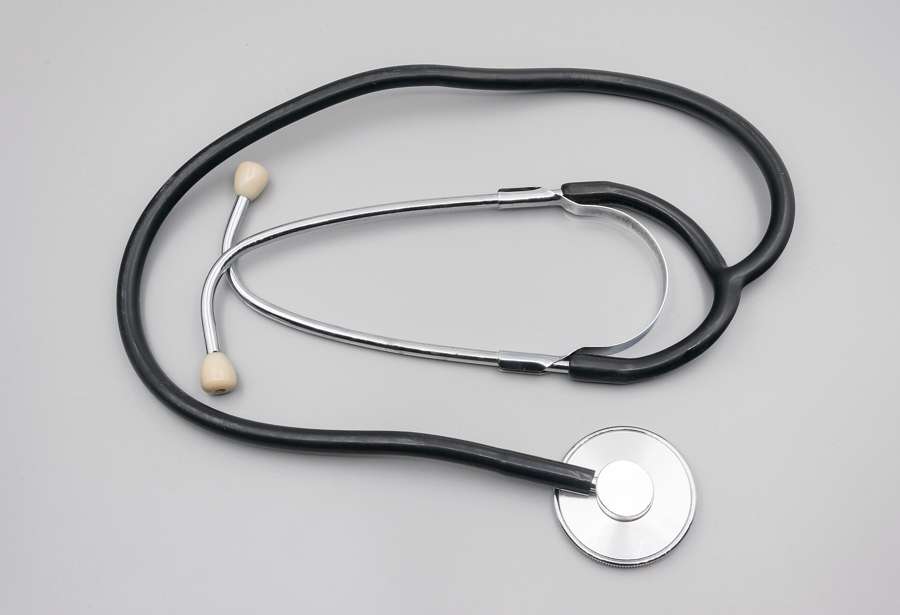 A stethoscope on a plain background