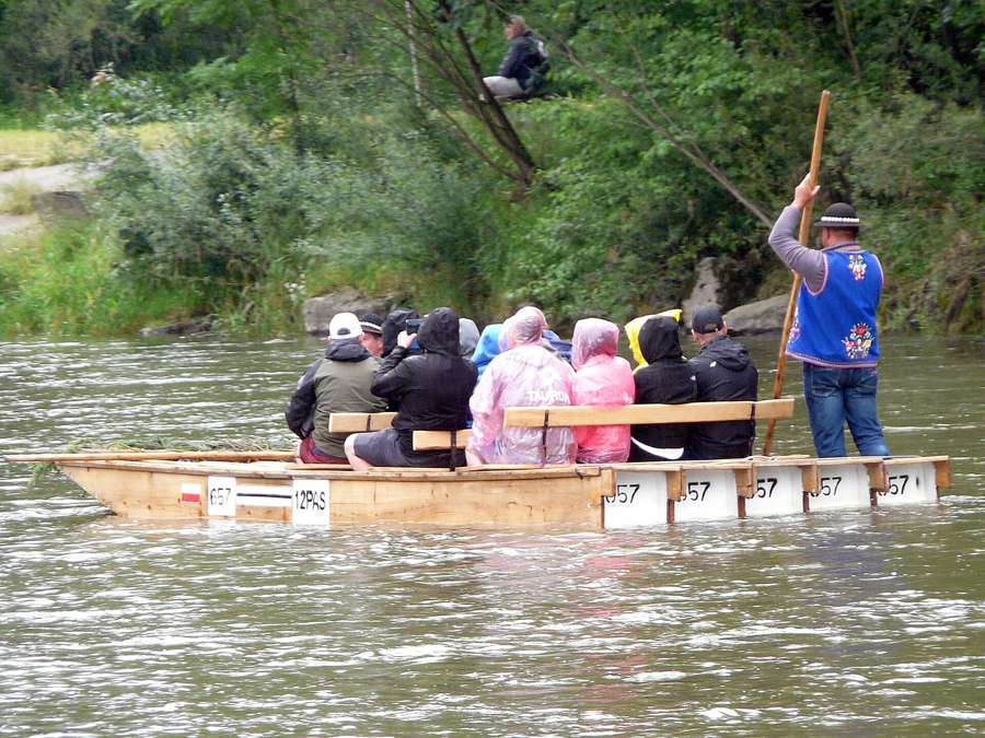 A traditional wooden flisak raft carrying passengers down the Dunajec