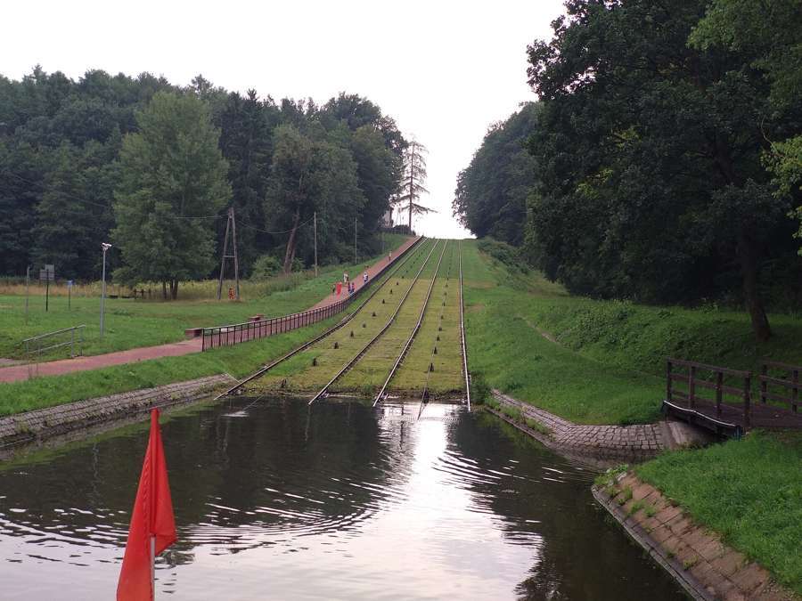 The Buczyniec inclined plane of the Elbląg Canal, with rail tracks climbing a grass slope