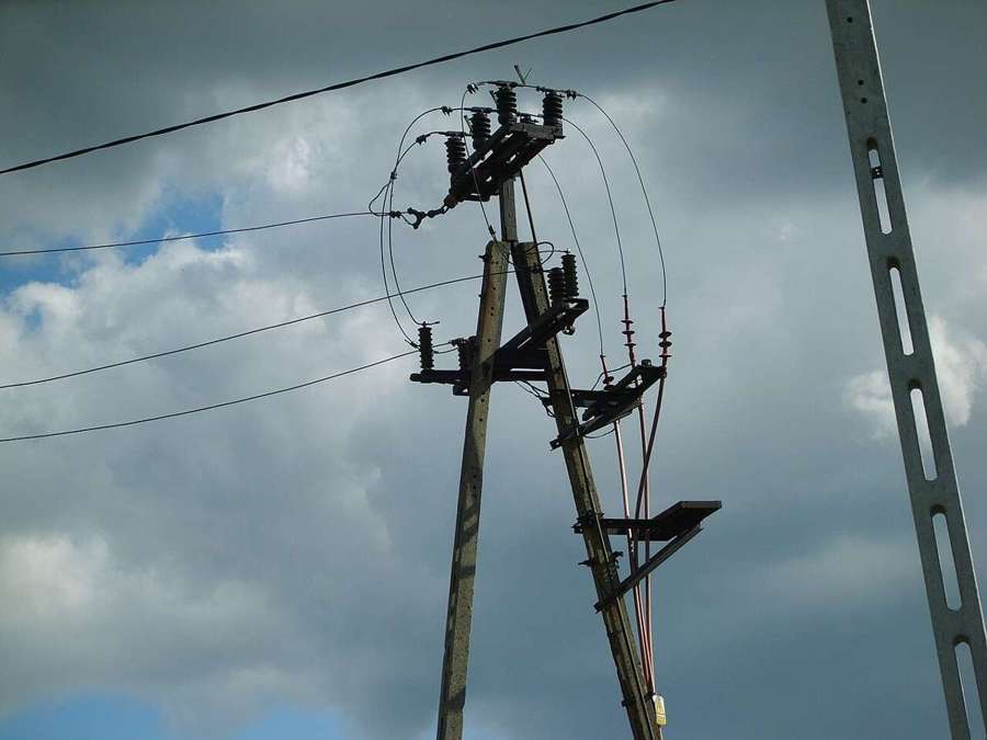 Electricity pole with insulators and power lines