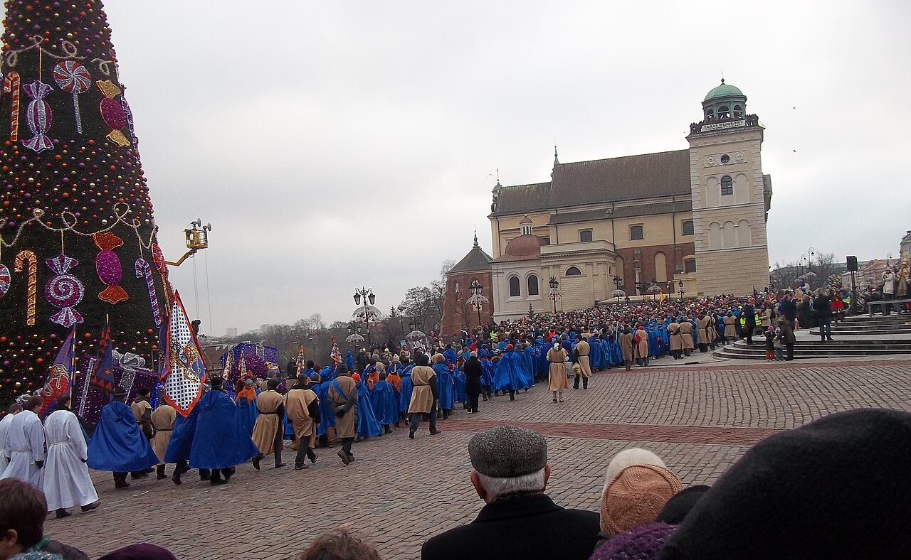 Costumed participants of the Three Kings Parade on Castle Square in Warsaw