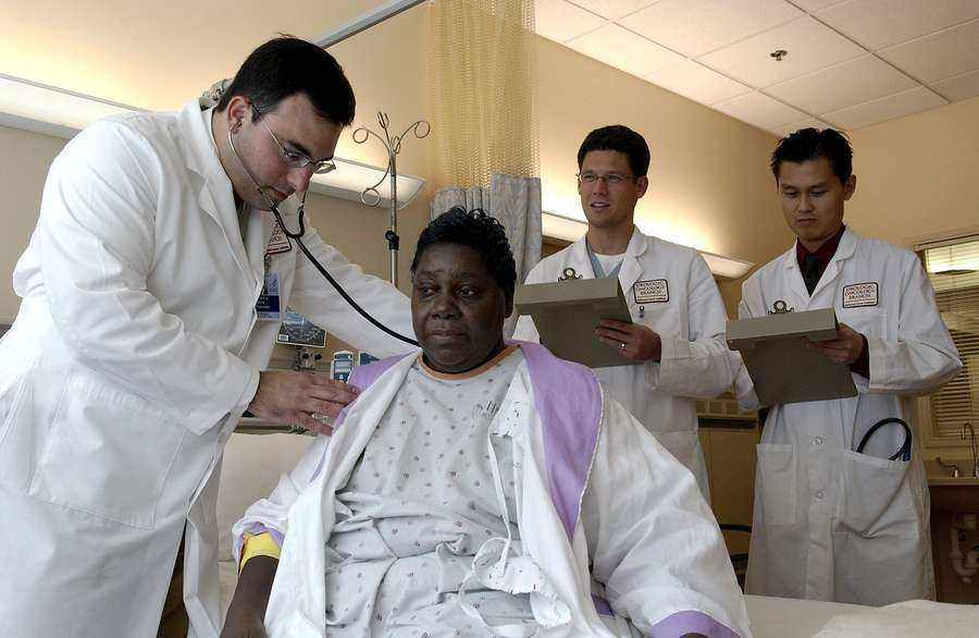 A doctor examining a patient with a stethoscope