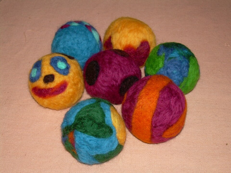 Colourful needle-felted wool balls with different surface patterns