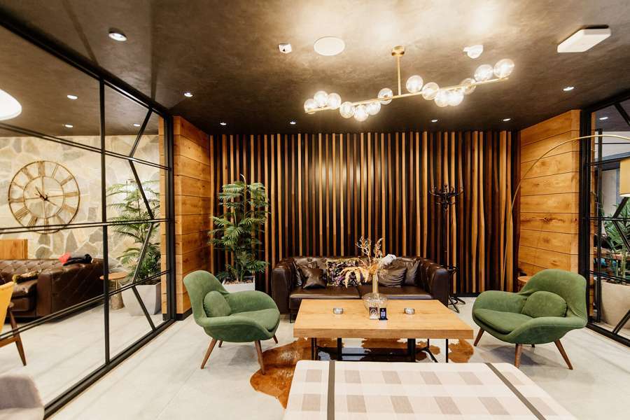 A calm consulting-room lounge - Warsaw's English-speaking therapy scene is private, bookable within weeks