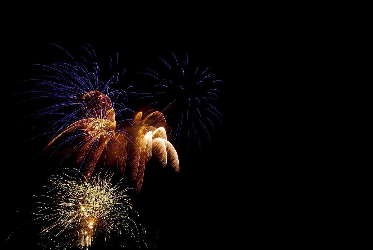 Fireworks display at night, illustrative