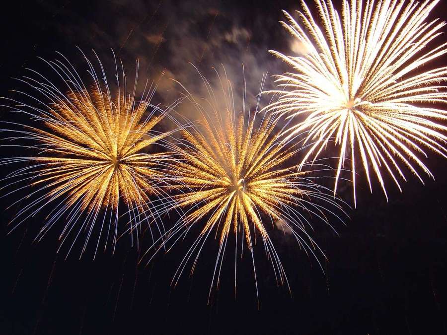 New Year fireworks over a city, illustrative
