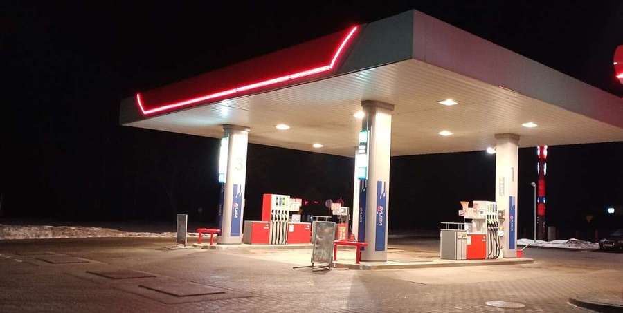 A petrol station at night in Poland