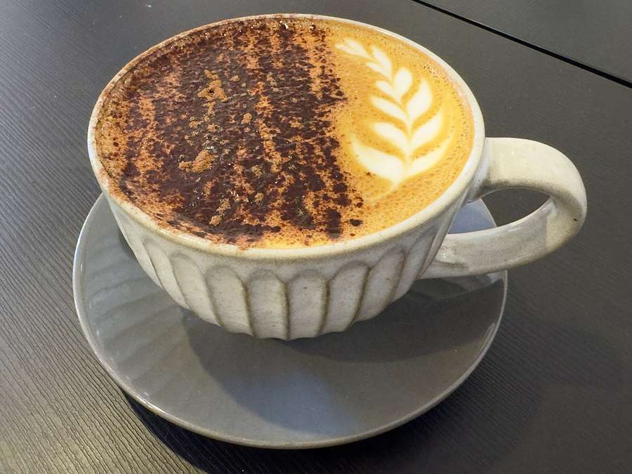 A cappuccino with latte art - Warsaw café culture