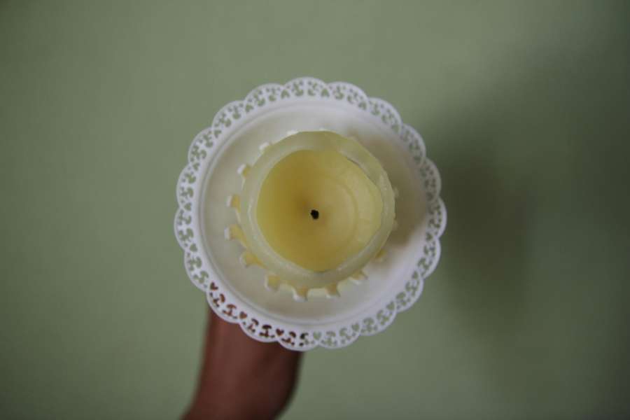 A traditional gromnica candle with a lace drip collar (okapnik), ready for the Candlemas blessing