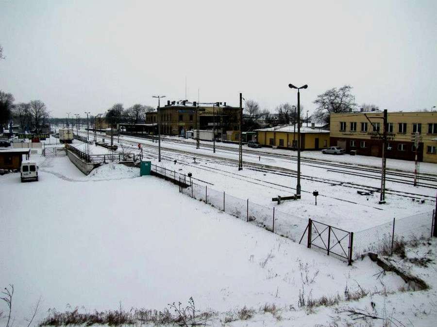 A railway station area in Inowrocław covered with snow