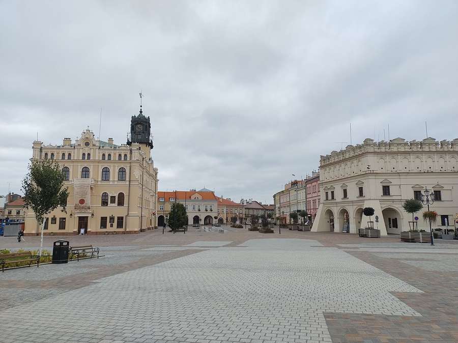 Town hall and market square in Jarosław under a cloudy sky