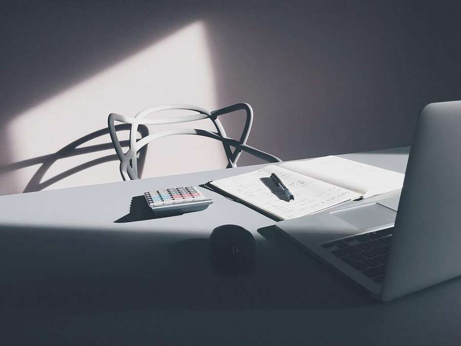 Desk with laptop and calculator