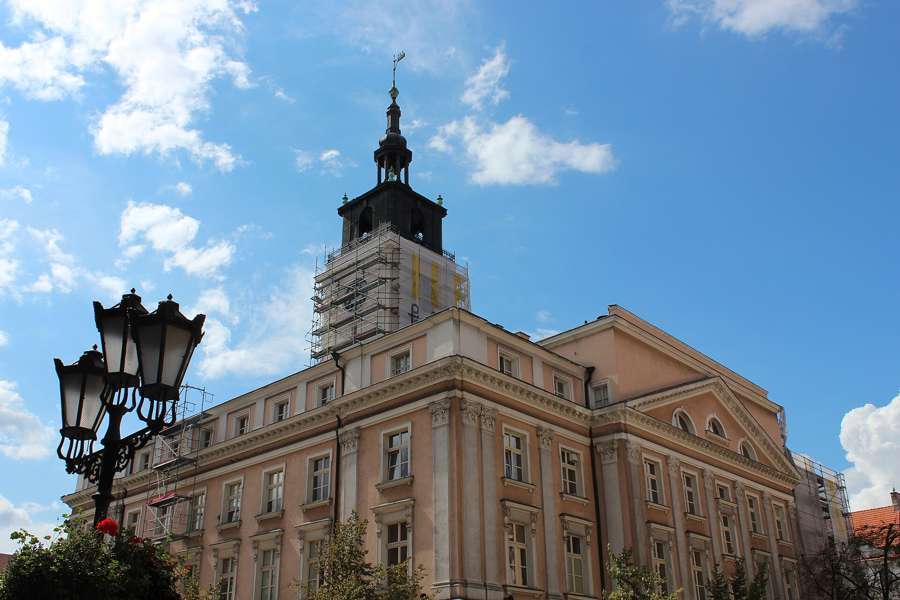 Kalisz town hall tower against a blue sky