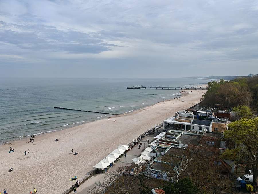 Kołobrzeg's wide beach and pier seen from above