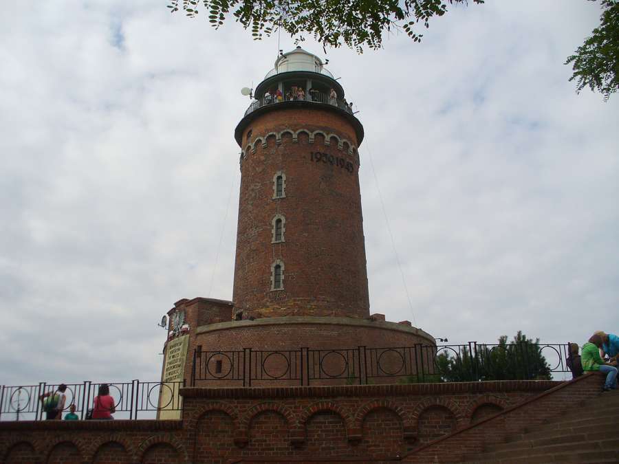 The brick lighthouse at the harbour entrance in Kołobrzeg