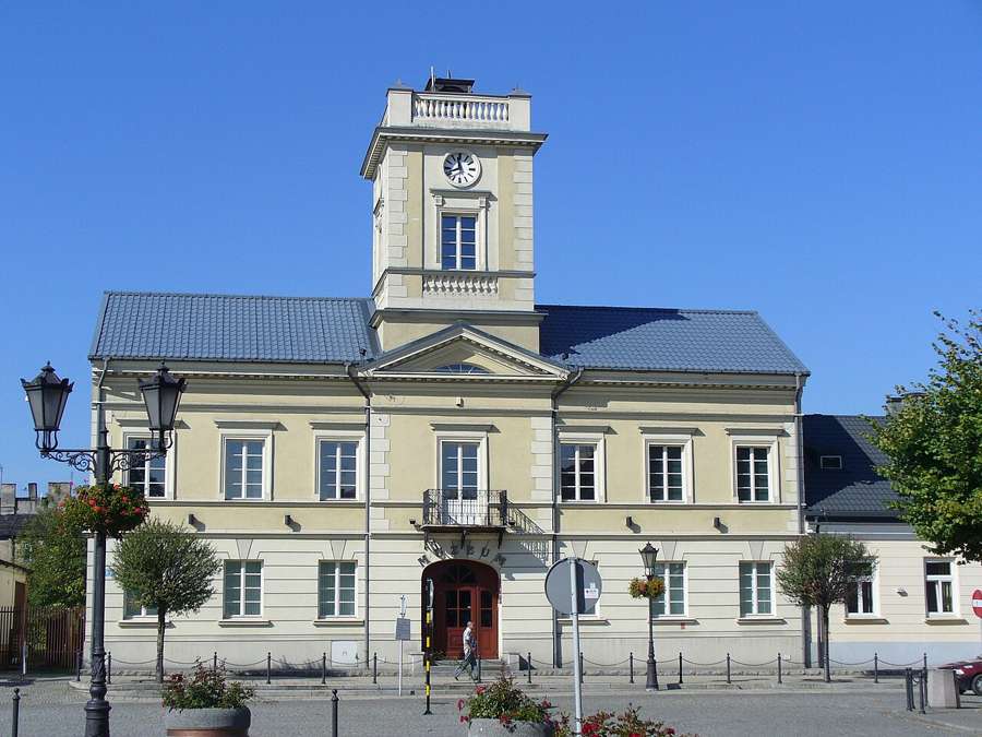 Kutno town hall with a clock tower under a blue sky