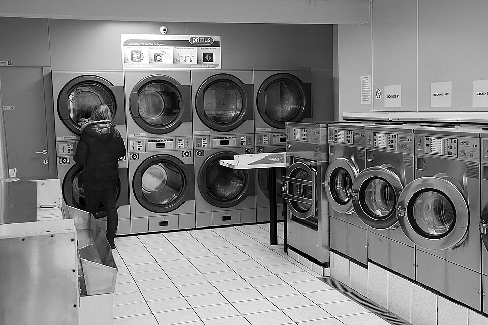 Rows of machines in a Mouscron laundromat photographed in March 2019