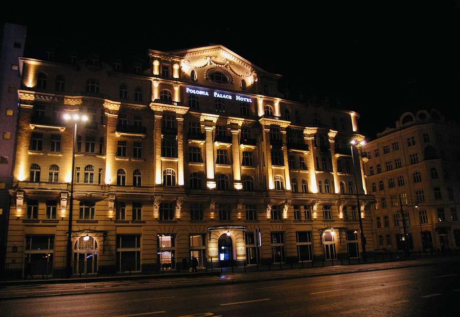 The Polonia Palace Hotel lit up at night