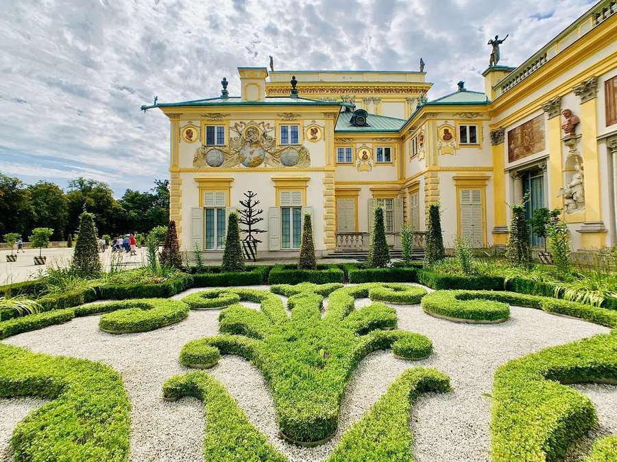 The baroque garden of Wilanów Palace in Warsaw, with clipped hedges and the palace façade