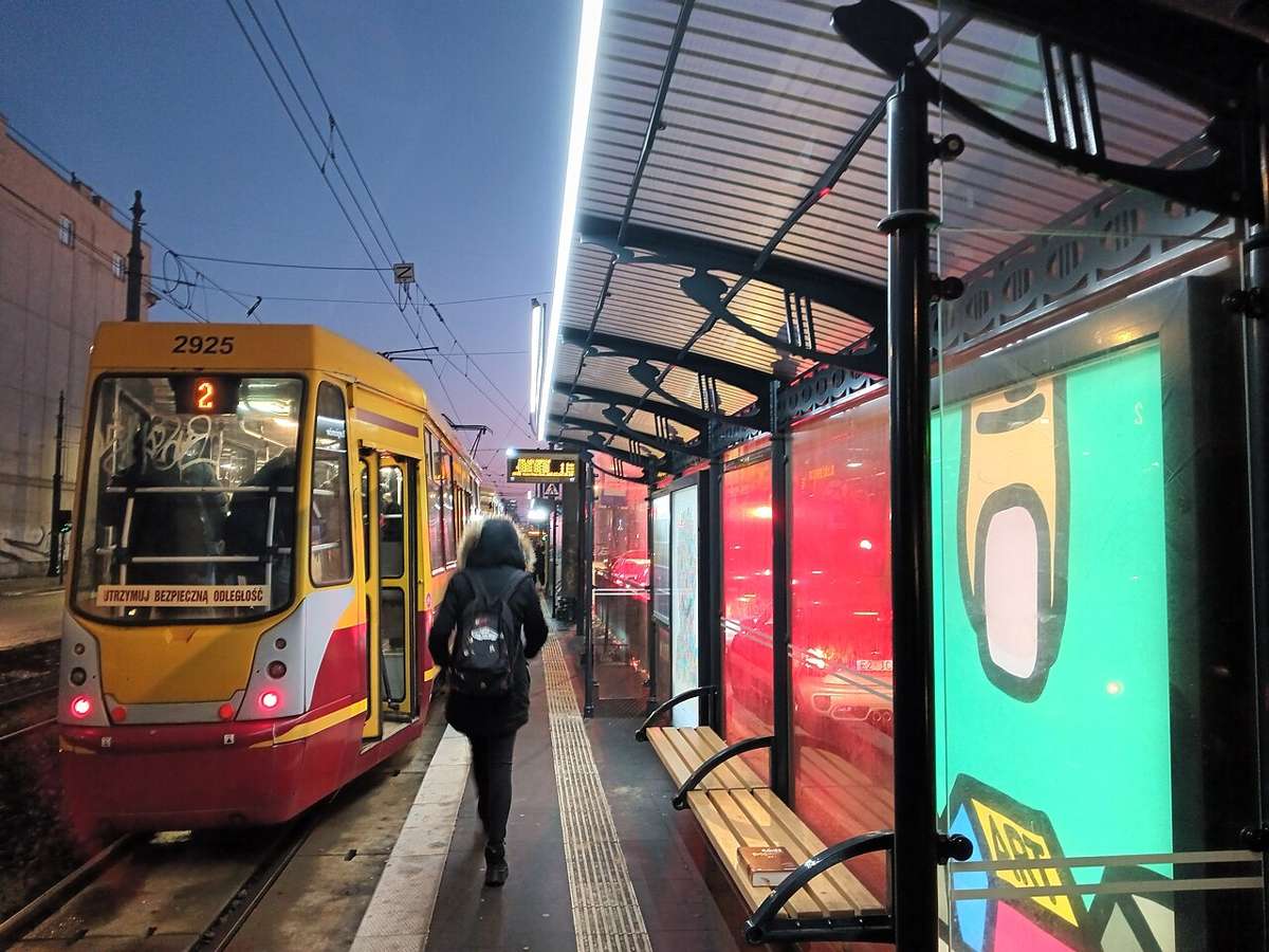 A Łódź tram stop at dusk