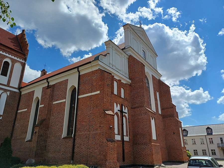 Brick cathedral in Łomża under a blue sky