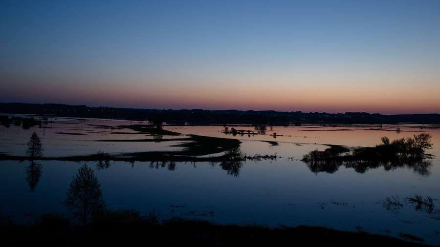 Sunset over the flooded meadows of the Narew valley in the Lomza Landscape Park