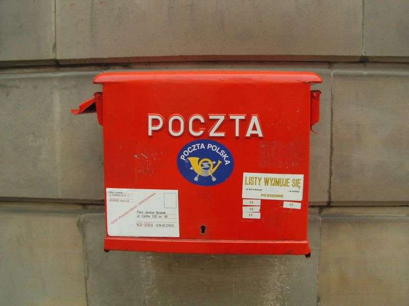 An archival red Poczta Polska posting box, not a collection counter or current service timetable