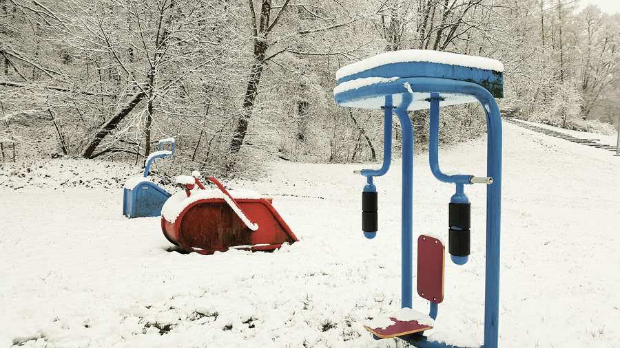 An outdoor gym in a Polish park - free, public, and one of the easiest places to turn routine into regular faces
