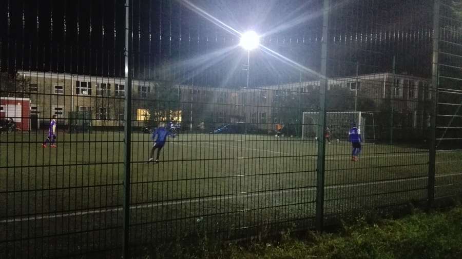 A night football game on a municipal Orlik pitch, one of the easiest ways into a Polish social circle