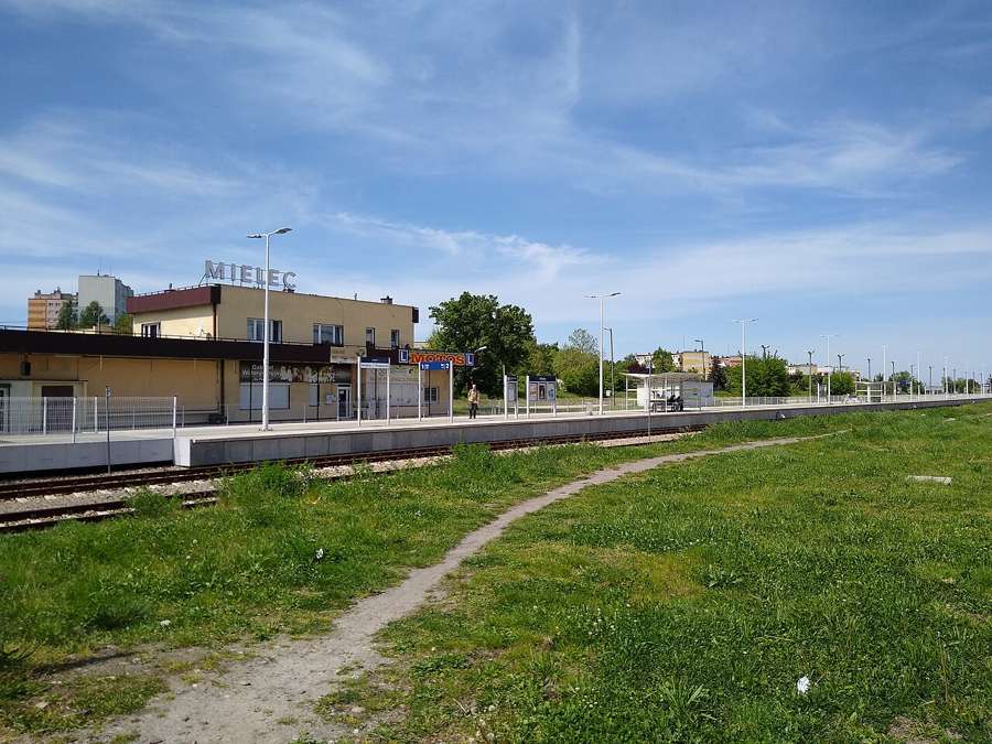 Mielec railway station platform and building on a sunny day