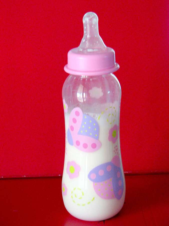 A baby bottle with milk
