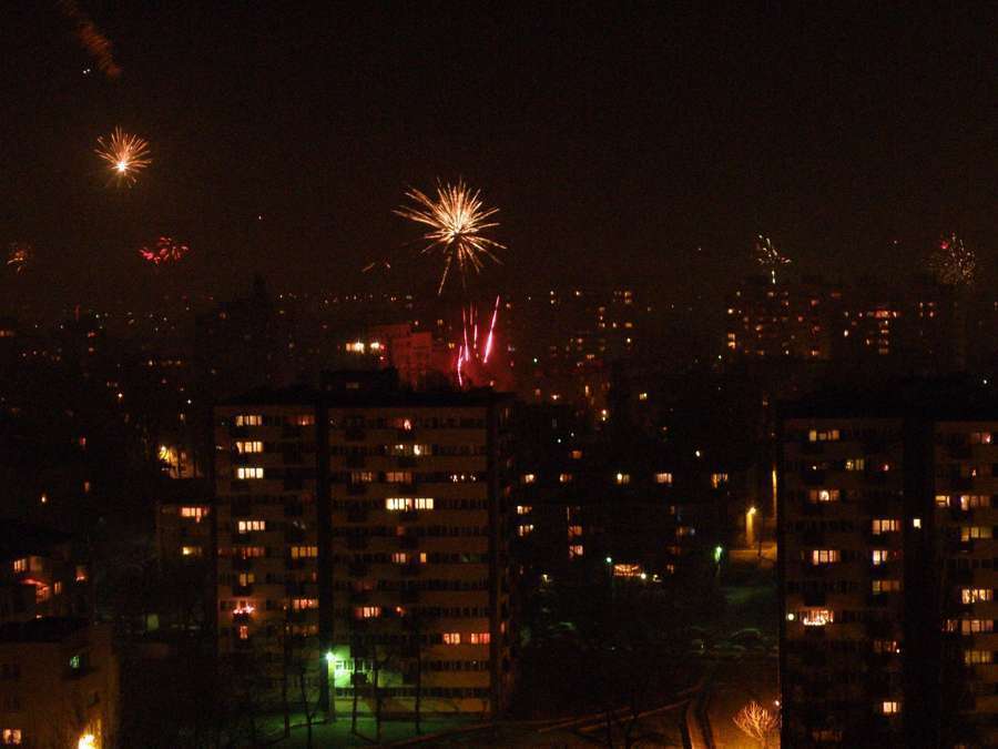Fireworks over a Warsaw housing estate at midnight on New Year's Eve