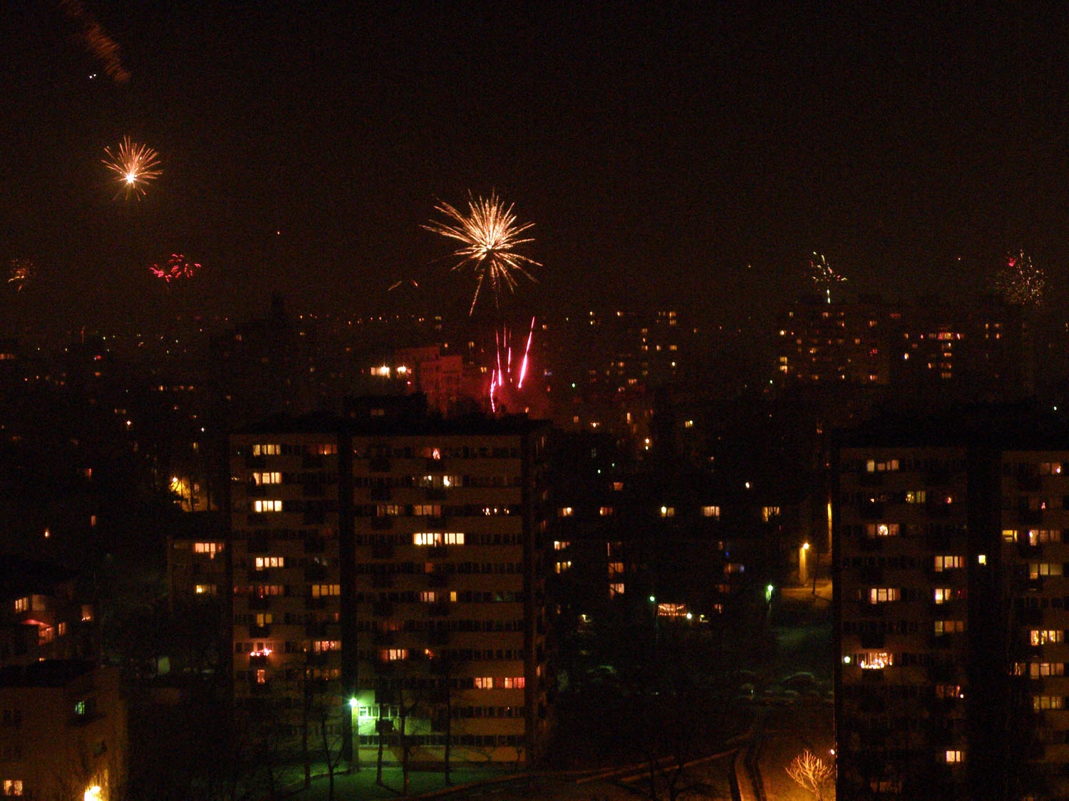 Fireworks over Warsaw apartment blocks on New Year's Eve