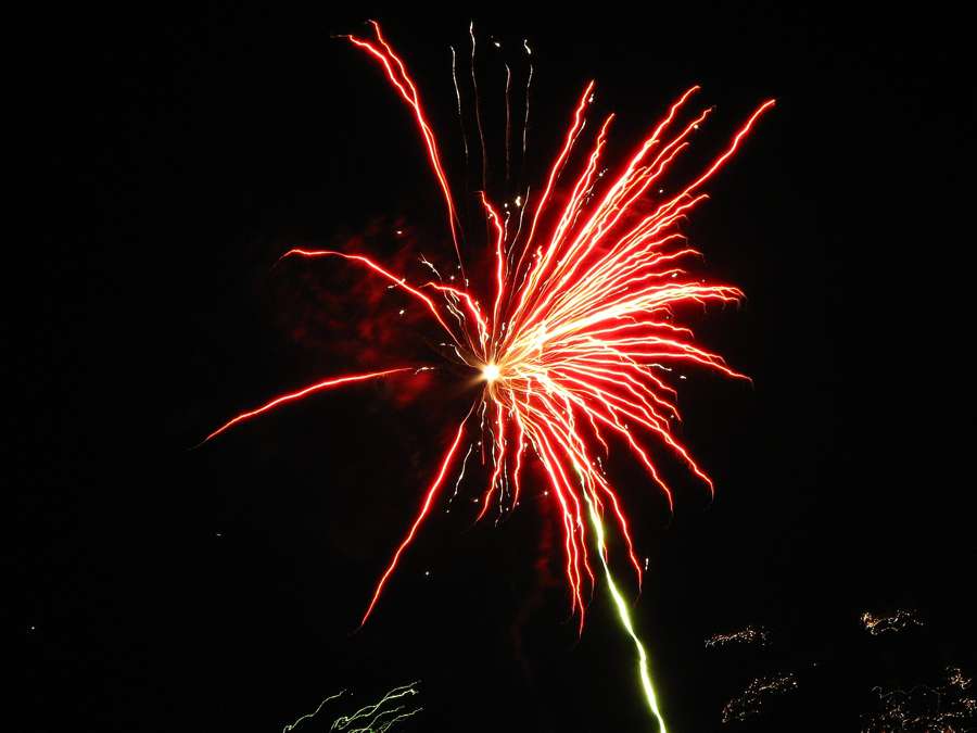 Red fireworks bursting over Krakow on New Year Eve