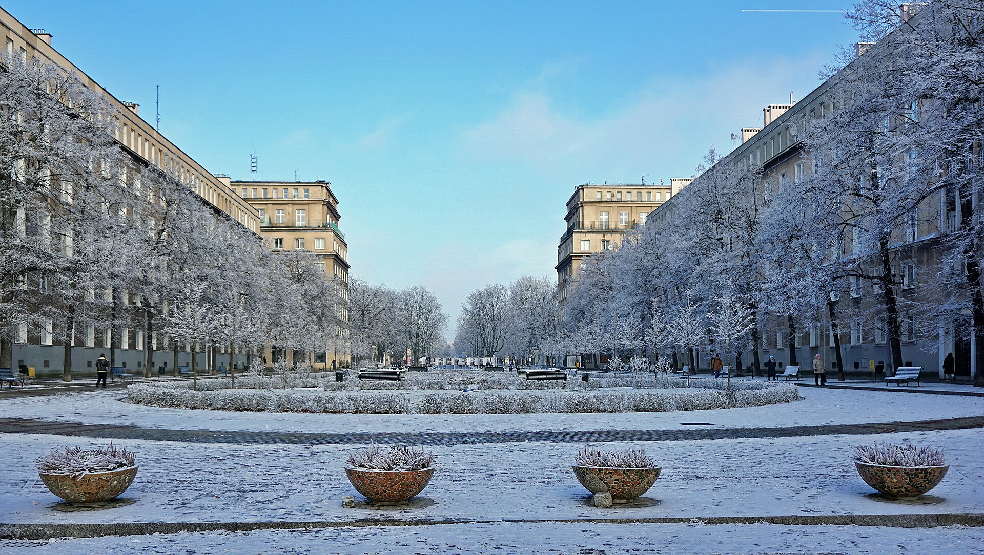 Snow-covered socialist realist housing blocks along Aleja Róż in Nowa Huta, Kraków