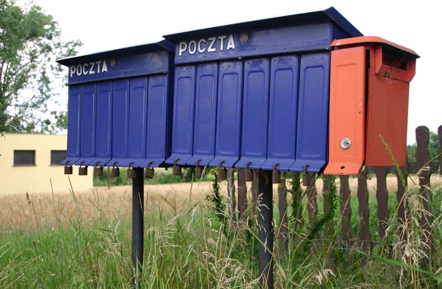 Rural mailboxes labeled POCZTA - official letters in Poland still arrive on paper