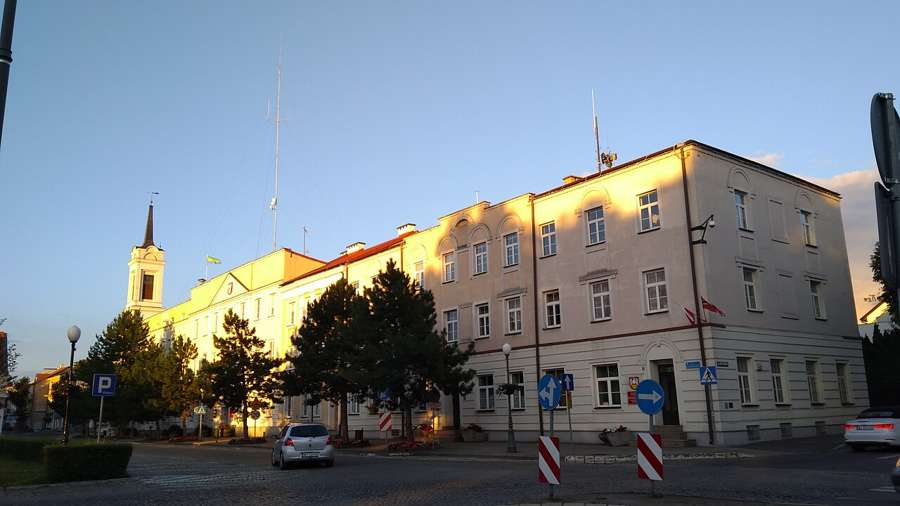 Town hall building in Ostrołęka at sunset