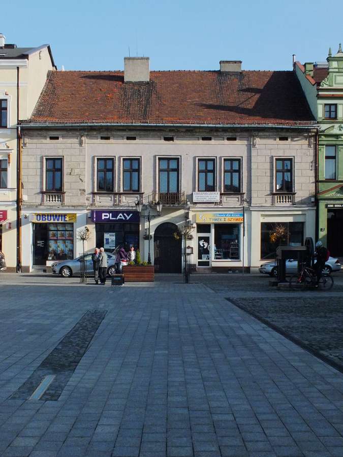 A historic townhouse with an annex on the main square in Oświęcim