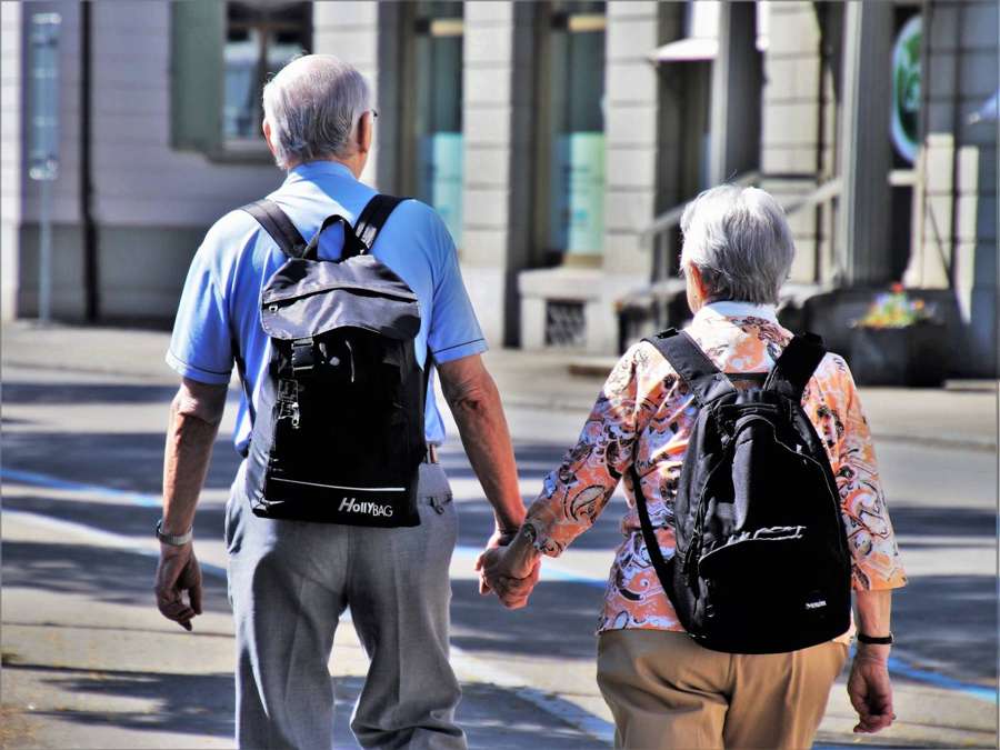 Elderly couple walking together