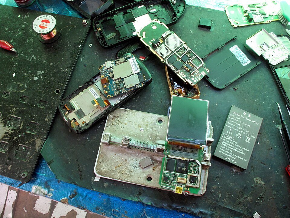 Mobile phone components on a repair workbench photographed in September 2009