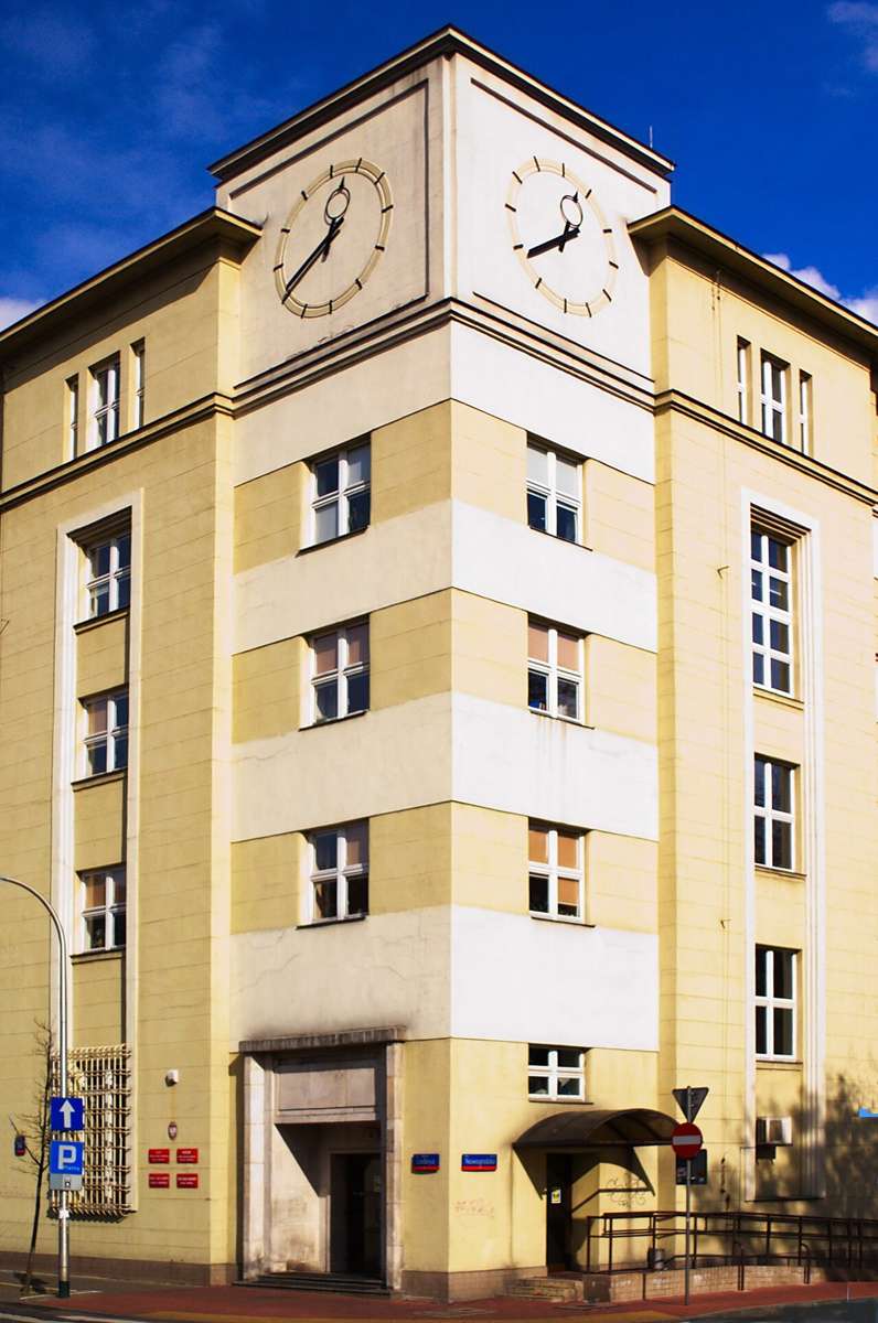 Corner building of a tax office in Warsaw with two clock faces